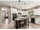 Spacious kitchen with large center island, tiled floors, and sleek appliances for modern living at 1078 W Redwood Ave, Queen Creek, AZ 85140
