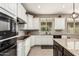 Stylish kitchen boasting granite countertops, stainless appliances, and ample cabinet space at 1078 W Redwood Ave, Queen Creek, AZ 85140