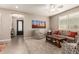 Inviting living room featuring a ceiling fan and plush carpet at 1078 W Redwood Ave, Queen Creek, AZ 85140