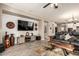 Comfortable living room features a large tv, light wood floors, and a cozy atmosphere at 1078 W Redwood Ave, Queen Creek, AZ 85140
