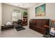 Home office featuring a desk, bookshelves, and a murphy bed cabinet for versatility at 1078 W Redwood Ave, Queen Creek, AZ 85140