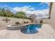 A large swimming pool and spa are surrounded by mature landscaping at 1078 W Redwood Ave, Queen Creek, AZ 85140