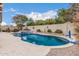 A beautiful backyard oasis featuring a pool, spa, and desert landscaping at 1078 W Redwood Ave, Queen Creek, AZ 85140