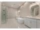 Spacious bathroom with a freestanding tub, dual vanities, and a glass-enclosed shower at 1244 N 106Th Pl, Mesa, AZ 85207