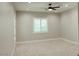 This bedroom features neutral walls, carpet flooring, recessed lighting, and a ceiling fan for added comfort at 1244 N 106Th Pl, Mesa, AZ 85207