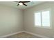 Bright bedroom features neutral walls, carpet flooring, recessed lighting, and a window with plantation shutters at 1244 N 106Th Pl, Mesa, AZ 85207