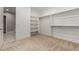 Well-organized walk-in closet with shelving and rods, providing ample storage space at 1244 N 106Th Pl, Mesa, AZ 85207