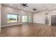 Large living room with recessed lighting, ceiling fans, and bright natural light at 1244 N 106Th Pl, Mesa, AZ 85207