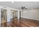 Bright bedroom with hardwood floors, ceiling fan and closet with mirrored doors at 1403 W Wood Dr, Phoenix, AZ 85029
