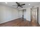 This bedroom offers dark wood floors and a mirrored closet at 1403 W Wood Dr, Phoenix, AZ 85029