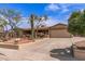 Delightful single-Gathering home boasting desert landscaping, a two-car garage, and a covered front porch at 1403 W Wood Dr, Phoenix, AZ 85029