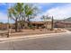 Attractive single-Gathering home with desert landscaping, mature trees, a two-car garage, and a covered front porch at 1403 W Wood Dr, Phoenix, AZ 85029