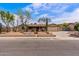 Inviting single story home featuring desert landscaping, a two-car garage, and a covered front porch at 1403 W Wood Dr, Phoenix, AZ 85029
