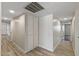 Bright hallway features neutral walls, wood-look flooring, and built-in storage cabinets at 1403 W Wood Dr, Phoenix, AZ 85029