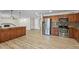 Bright open kitchen is enhanced with granite counters, stainless appliances, and breakfast bar at 1403 W Wood Dr, Phoenix, AZ 85029