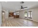 Open-concept living room boasts wood floors and glass doors leading to the outdoor area at 1403 W Wood Dr, Phoenix, AZ 85029