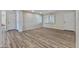 Bright living room featuring wood floors, neutral walls, recessed lighting, and a window with plantation shutters at 1403 W Wood Dr, Phoenix, AZ 85029