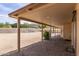 Covered patio with brick flooring offering shade and a comfortable outdoor living space with view to the yard at 1403 W Wood Dr, Phoenix, AZ 85029
