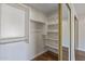Walk-in closet features custom shelving and ample storage space at 1403 W Wood Dr, Phoenix, AZ 85029