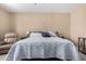 Primary bedroom featuring soft carpet, a window, and a relaxing reading nook at 14390 W Desert Flower Dr, Goodyear, AZ 85395