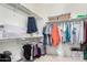 Spacious walk-in closet with ample shelving and hanging space for organized storage at 14390 W Desert Flower Dr, Goodyear, AZ 85395