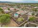Beautiful aerial shot of the home highlighting the backyard with a pool, landscaping, and neighborhood at 14539 W Becker Ln, Surprise, AZ 85379