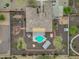 Aerial view of the property showcasing the backyard with a pool, patio, and landscaping at 14539 W Becker Ln, Surprise, AZ 85379