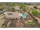 Drone shot of the backyard featuring a pool, spa, patio, and desert landscaping at 14539 W Becker Ln, Surprise, AZ 85379
