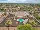 Expansive backyard with pool, covered patio, desert landscaping, and privacy walls in a residential neighborhood at 14539 W Becker Ln, Surprise, AZ 85379
