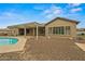 Relaxing outdoor space featuring a pool, covered patio, and low-maintenance desert landscaping at 14539 W Becker Ln, Surprise, AZ 85379