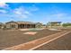Lush backyard featuring a sparkling pool, covered patio, and beautifully landscaped areas perfect for entertaining at 14539 W Becker Ln, Surprise, AZ 85379