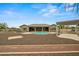 Expansive backyard featuring a pool, hot tub, and a covered patio, perfect for outdoor living and entertaining at 14539 W Becker Ln, Surprise, AZ 85379