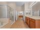 Large bathroom with separate shower, vanities, and tile flooring at 14539 W Becker Ln, Surprise, AZ 85379