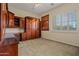 Bedroom showcasing beautiful built-in cabinets and drawers with a desk and murphy bed at 14539 W Becker Ln, Surprise, AZ 85379
