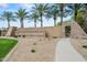 Copper Canyon Ranch entrance with decorative stone signage and lush landscaping, creating a welcoming community at 14539 W Becker Ln, Surprise, AZ 85379