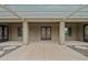 Charming covered front entrance with decorative double doors and elegant architectural details at 14539 W Becker Ln, Surprise, AZ 85379