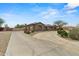 Charming home with desert landscaping, a long private driveway, and attached garage at 14539 W Becker Ln, Surprise, AZ 85379