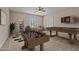 Spacious game room featuring a foosball table, pool table, and cozy seating area, perfect for entertaining guests at 14539 W Becker Ln, Surprise, AZ 85379