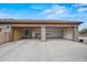 Spacious three-car garage offering built-in storage and ample room for vehicles and projects at 14539 W Becker Ln, Surprise, AZ 85379