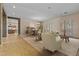 Open-concept living room and dining area showcasing tile flooring, a neutral color palette, and ample natural light at 14539 W Becker Ln, Surprise, AZ 85379