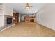 Spacious living room featuring a fireplace, wine cooler, and an open layout to the kitchen at 14539 W Becker Ln, Surprise, AZ 85379