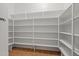 A bright pantry with plenty of shelving for storage and organization at 14539 W Becker Ln, Surprise, AZ 85379