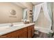 Bathroom vanity featuring a sink, mirror, and stylish decor at 15829 W Boca Raton Rd, Surprise, AZ 85379