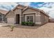Charming single-story home featuring a two-car garage and a well-maintained front yard at 15829 W Boca Raton Rd, Surprise, AZ 85379