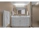 Bright bathroom featuring a vanity, large mirror, and a glass shower at 16739 E El Lago Blvd # 103, Fountain Hills, AZ 85268
