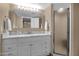 Bright bathroom featuring a vanity, large mirror, and a glass shower at 16739 E El Lago Blvd # 103, Fountain Hills, AZ 85268