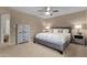 This bedroom features an inviting bed, a ceiling fan, and matching nightstands at 16739 E El Lago Blvd # 103, Fountain Hills, AZ 85268