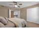 Cozy bedroom with ceiling fan featuring carpeted floors and white closet doors at 16739 E El Lago Blvd # 103, Fountain Hills, AZ 85268