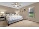 Cozy bedroom featuring a soft bed, neutral colors, and a window with natural light at 16739 E El Lago Blvd # 103, Fountain Hills, AZ 85268