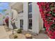 Charming building exterior with flowering vines, stucco facade, and inviting entrance at 16739 E El Lago Blvd # 103, Fountain Hills, AZ 85268